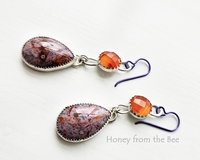 Lavender and orange gemstone drop below faceted orange gemstone earrings