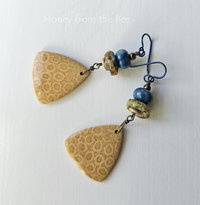 Golden fossilized coral agate earrings with blue and yellow lampwork
