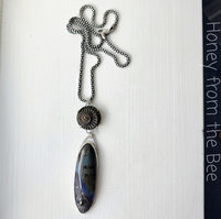 Artisan necklace features ammonite and ceramic focals