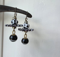 Playful earrings in black and white