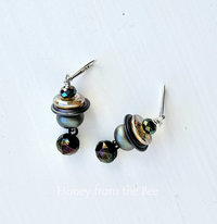 Moody earrings feature lampwork and crystal in iridescent shades