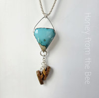 Artisan pendant features blue gem turquoise