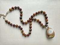 Red and brown necklace features jasper gemstones