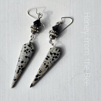 Evening earrings feature Dalmatian stone and crystals