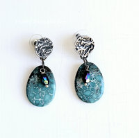 Turquoise earrings feature reticulated silver posts