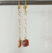 Long dangle earrings in red and gold