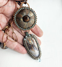 One of a kind art pendant features Prudent Man Plume Agate from Idaho, ceramic cabochon and bead embroidery