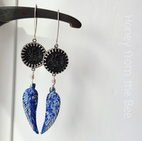 Feather earrings in blue, black and silver