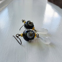 Daisy earrings feature lampwork by Lori Lochner and a vintage glass drop