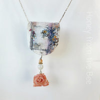 Floral necklace in white, coral and purple