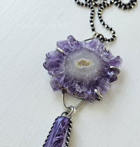 Amethyst crystal slice is featured in this artisan necklace