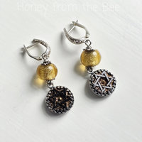 Gold and Silver earrings with antique black glass button