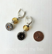 Star earrings in black, gold and silver