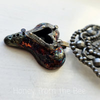 Raku heart necklace with upcycled buckle focal