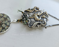 Art Nouveau crane pressing set in sterling silver as a pendant