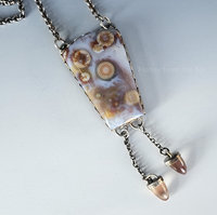 Old stock ocean jasper in palest lavender with orange orbs pair with dangling sunstones in this artisan necklace.