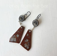Red and grey earrings feature antique buttons and jasper