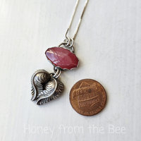 Small gemstone pendant in silver and pink