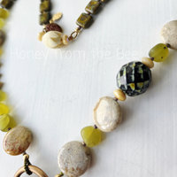 Green and cream artisan necklace in garden theme