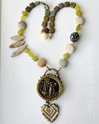 Garden theme necklace in green, cream and gold