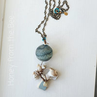 Aqua and white necklace for the beach features found shells