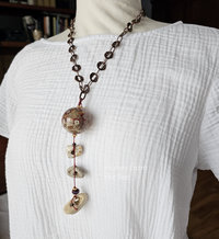 Hag stone necklace with hollow lampwork in red and cream