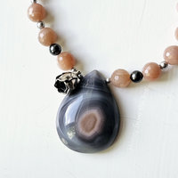 Botswana Agate teardrop necklace with faceted peach moonstone and grey pearls