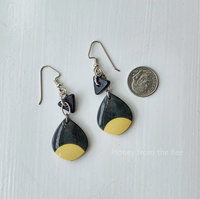 Lightweight artisan earrings feature drops made from a billiard ball