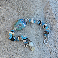Soothing blues and greens are the color scheme of this bead bracelet.