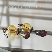 Yellow and red earrings in ceramic and glass