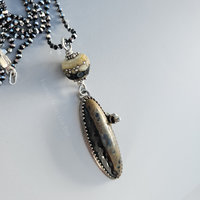 Ceramic cabochon set in sterling silver with lampwork necklace