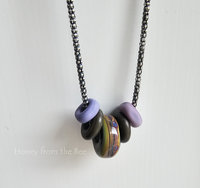 Lampwork necklace in purple, green and bronze