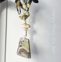 Nature inspired necklace features mushroom rhyolite and mushroom lampwork