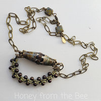 Brown pearl necklace with lampwork focal