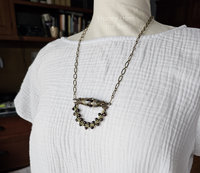 Warm tone necklace on model
