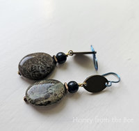 Green gemstone earrings with brass accents