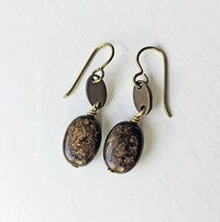 Brown gemstone earrings with flecks of gold