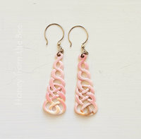 Pink shell earrings feature carved Celtic Knot