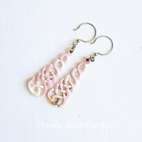 Long pink earrings in Celtic knot motif in shell