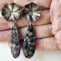 Metalworked earrings in silver and black