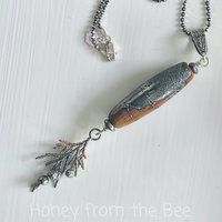 Nature inspired pendant in terra cotta and silver