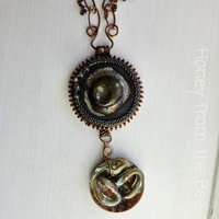 Statement pendant in copper, ceramic and glass