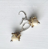 Lampwork earrings in cream and silver are inspired by the ocean
