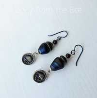iridescent earrings in blue and red