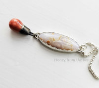 Old stock ocean jasper in white and orange with orange ceramic drop pendant necklace