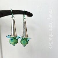 Green and aqua earrings feature sterling silver