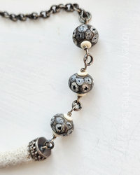 Black and white lampwork necklace with found white coral focal