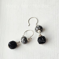 Statement earrings in black and white