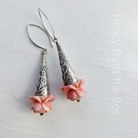 Flower Lover earrings feature pink flowers on sterling silver