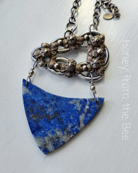 Antique buckle with lapis lazuli necklace in blue, brass and silver